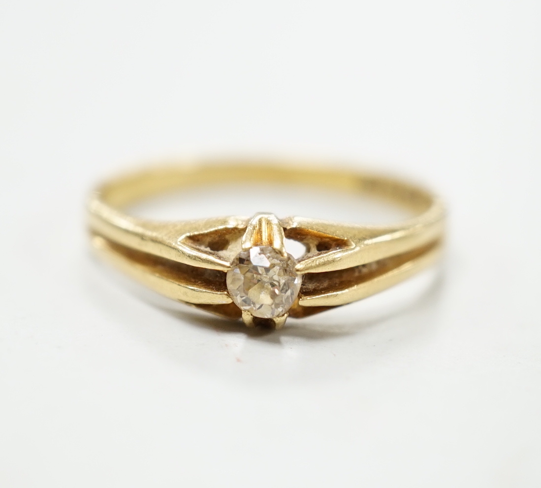 A George V 18ct gold and claw set solitaire diamond ring, size P, gross weight 3 grams.